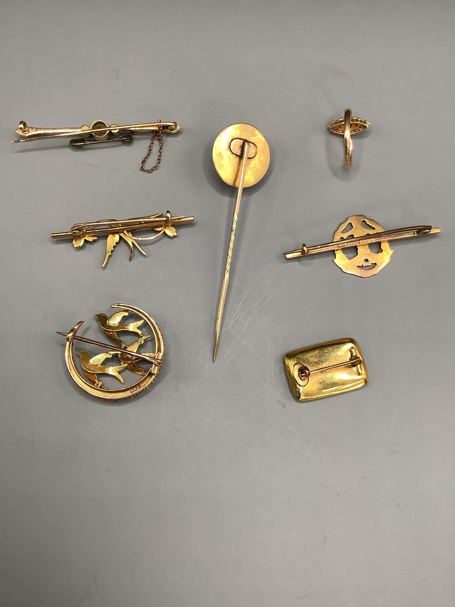 Mixed mainly Victorian jewellery including two yellow metal and seed pearl set swallow brooches, a 9ct and enamel military brooch, a 15ct and gem set bar brooch, a foil backed rock crystal and split pearl set stick pin,